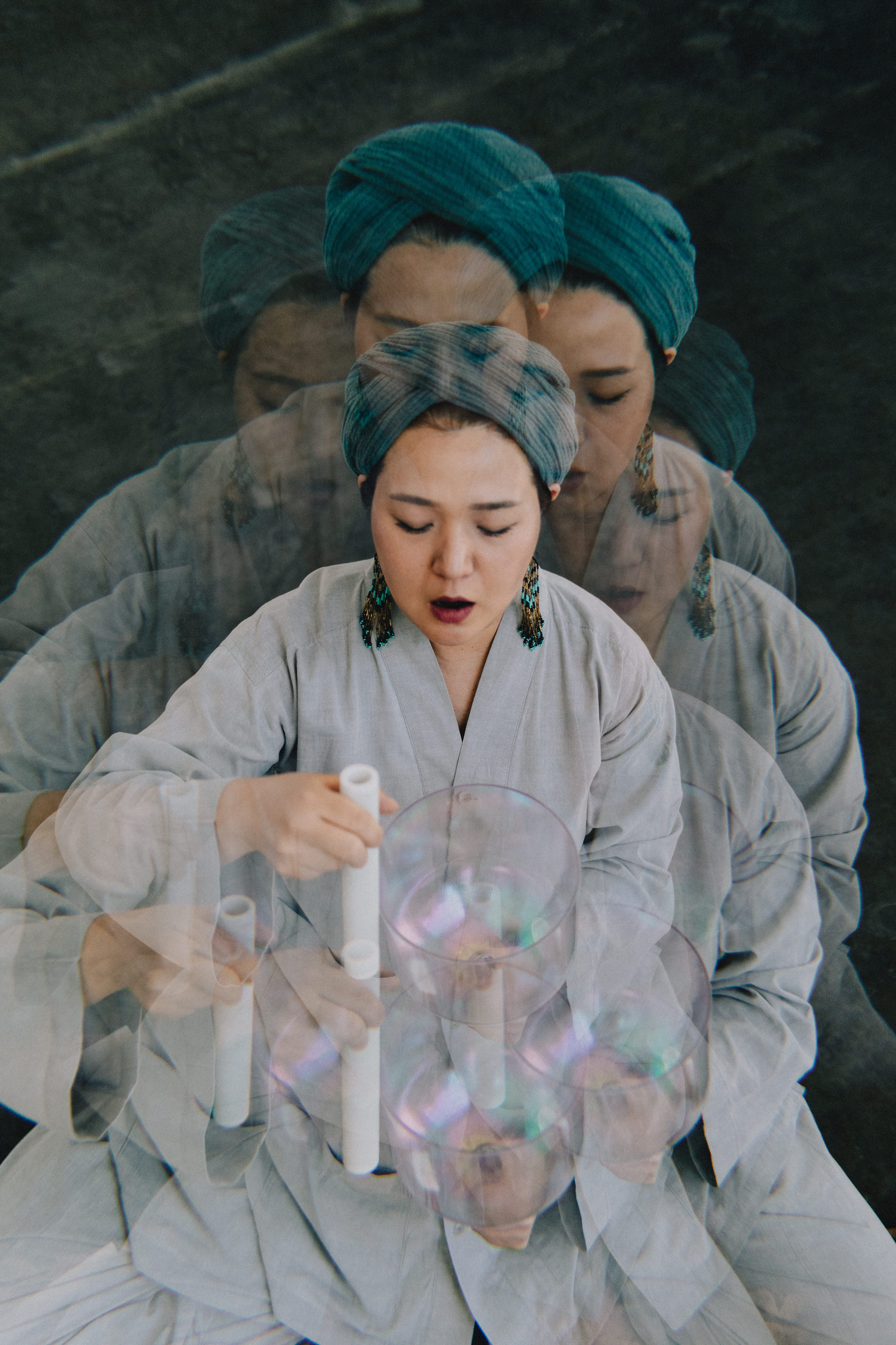 Seyeong playing crystal singing bowl during a sound attunement session